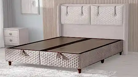 EXELEN BAZA 140x190 modeli, açık renkli kumaş kaplama ve dekoratif başlık detaylarıyla modern baza